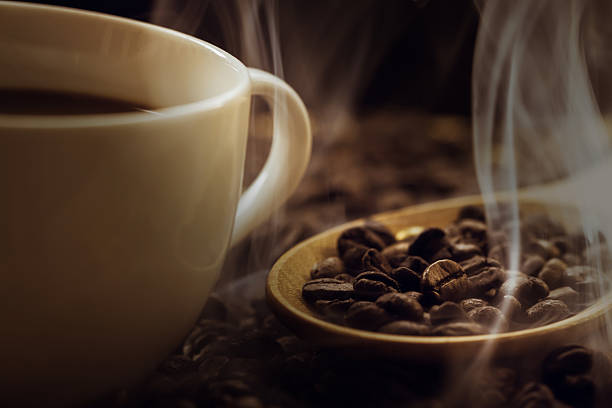 istock close up of fresh coffee beans with smoke 478325016