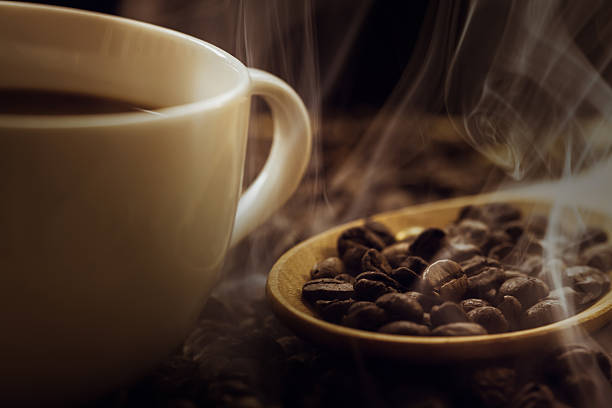 istock close up of fresh coffee beans with smoke 478325020