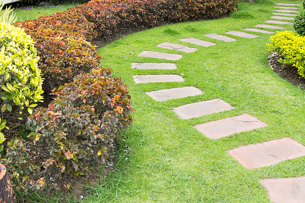 istock Stone footpath in lawn field 478326234