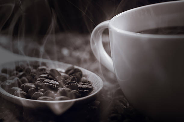 istock close up of fresh coffee beans with smoke 478326966