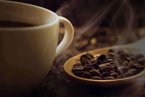 istock close up of fresh coffee beans with smoke 478327370