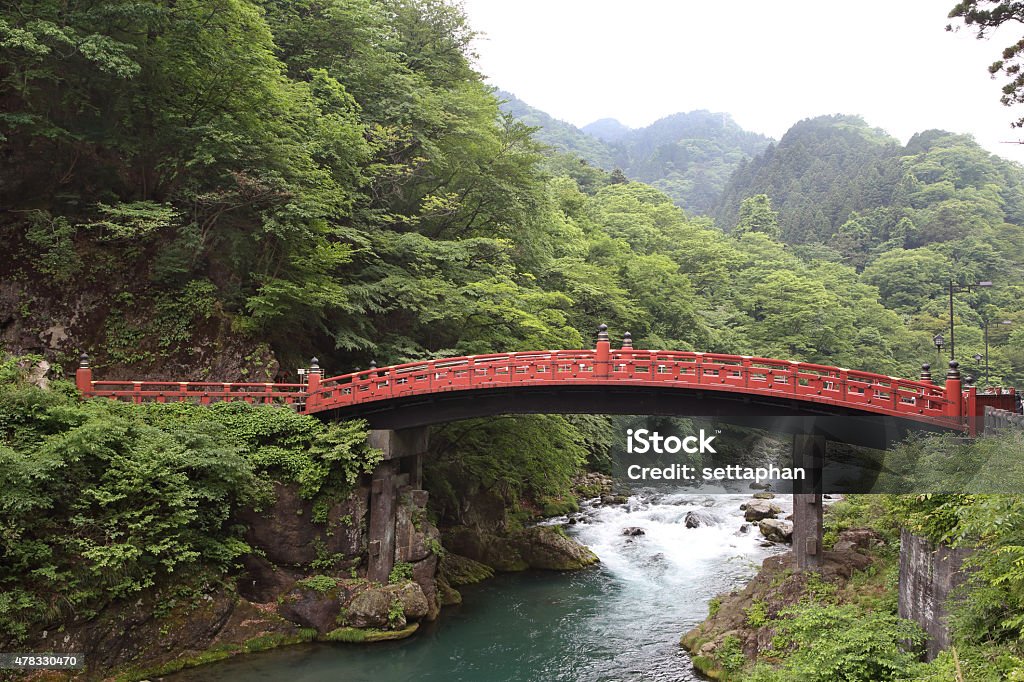 Red Bridge on decorate of garden and canal on Japanese Red Bridge on decorate of garden and canal on Japanese style East Asia 2015 Stock Photo