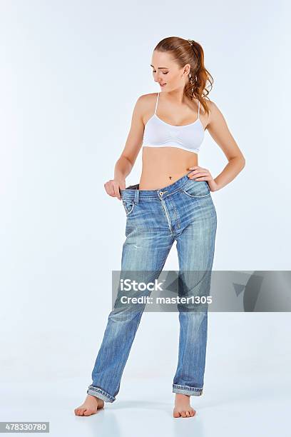 Woman Became Skinny And Wearing Old Jeans Stock Photo - Download Image Now - 2015, Achievement, Adult