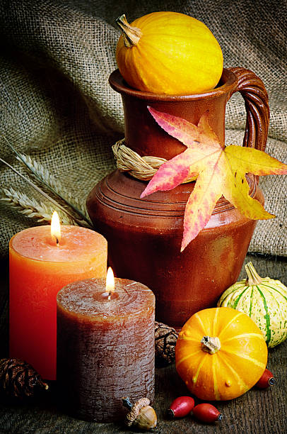 istock Autumn setting with candles and pumpkins 478332689