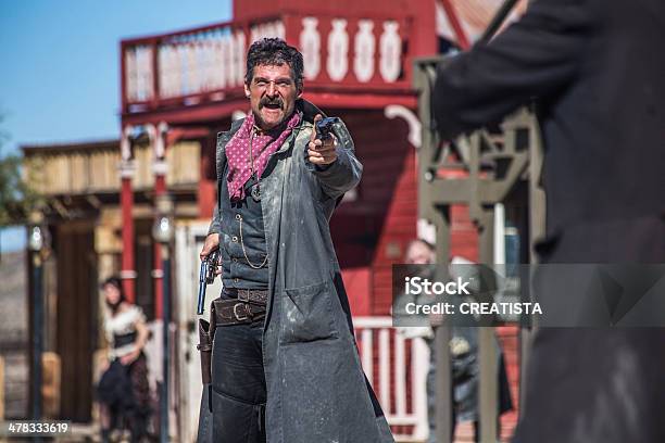 Sheriff Duels Bandit In Town Stock Photo - Download Image Now - Cowboy, Wild West, Shootout
