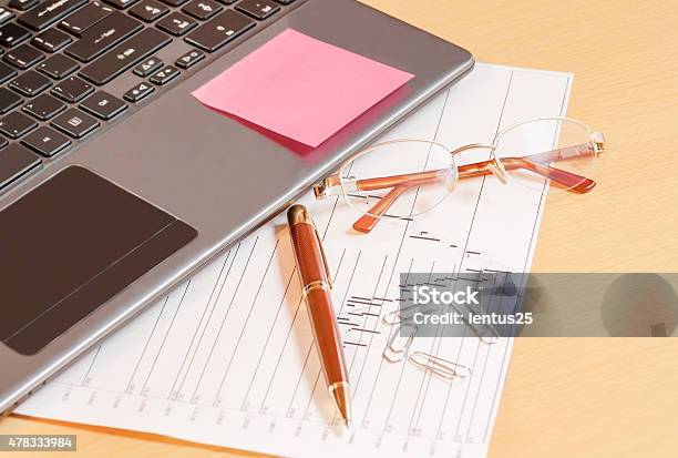 Laptop Pen And Glasses On Office Desk Selective Focus On Glasses Stock Photo - Download Image Now