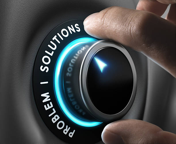 Business Solutions Solution switch positioned on the word solutions over grey background with blue lights. Concept of problem solving. corrective action stock pictures, royalty-free photos & images