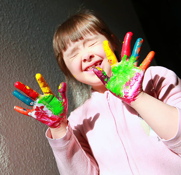 istock Cute little girl with painted hands 478335934