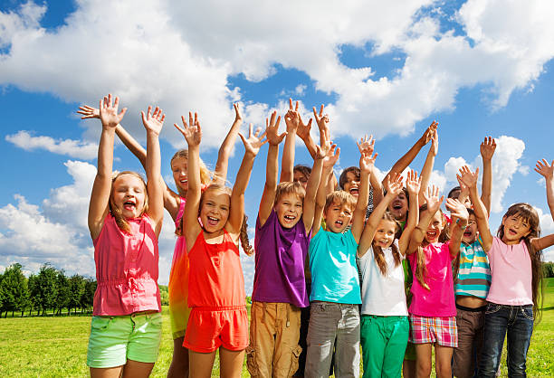 Poor  Children’s Standing Together in Winter Season Outdoor Portrait.