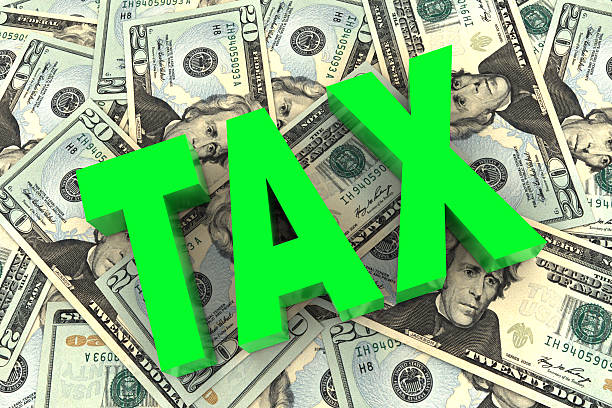 istock Tax on Money Background 478336071