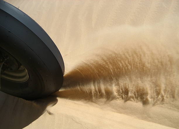 Sand Tire Races Across Desert Floor stock photo