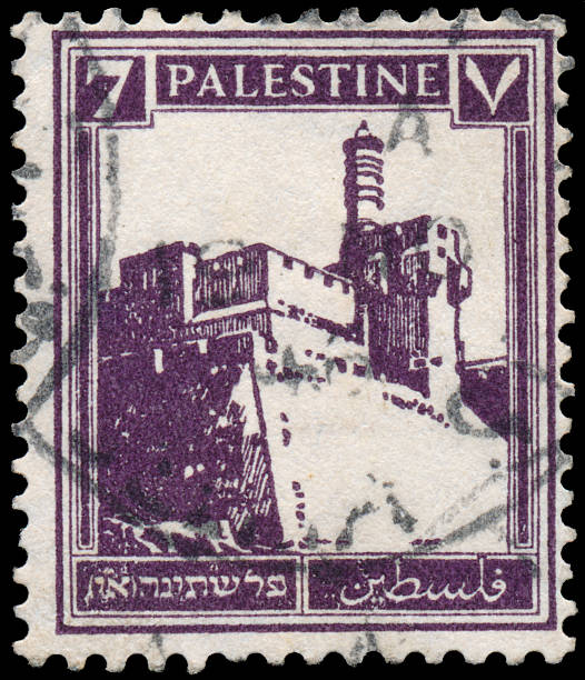 istock Stamp printed in Palestine shows building 478336293