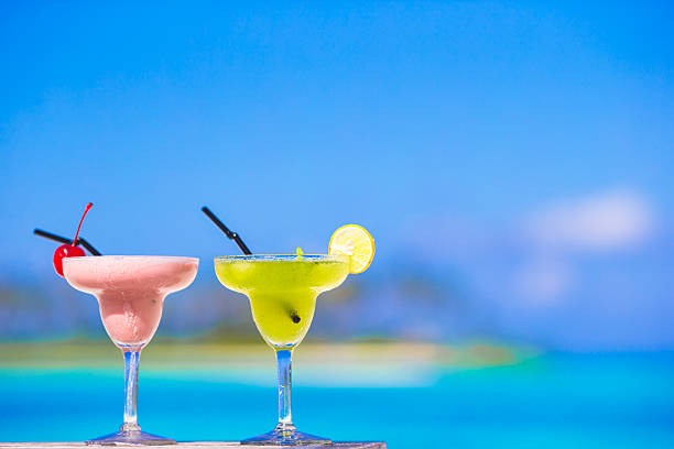 istock Two tasty cocktails on tropical white beach 478336390