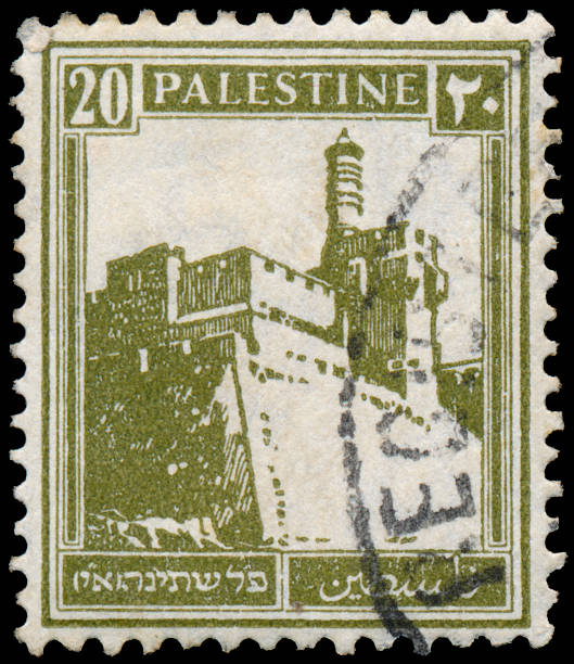 istock Stamp printed in Palestine shows building 478336643