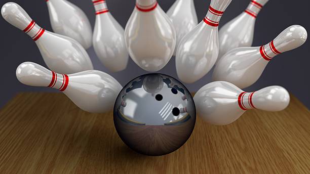 istock Bowling Ball and Pins on Moment of Strike Impact 478337633