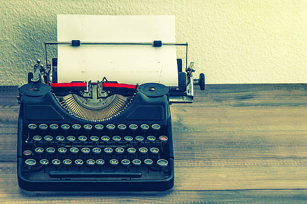 istock retro typewriter with white paper page. vintage style 478344067