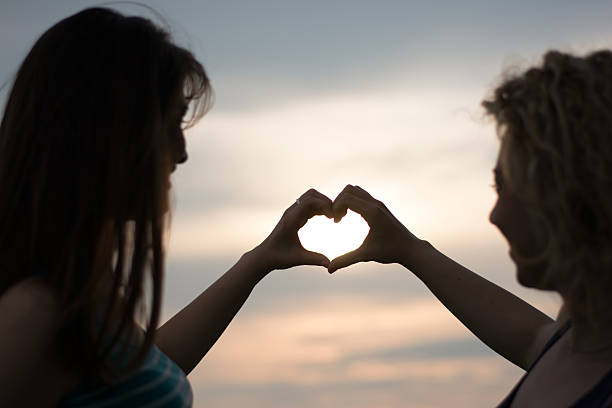 istock Two girls making heart shape 478344504