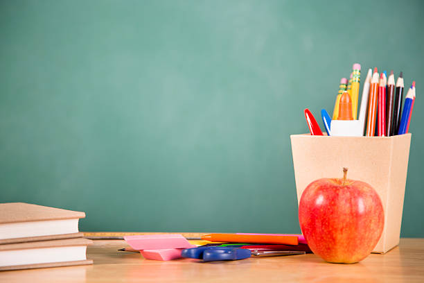 istock Back to school. School supplies, apple on desk. Education. 478344776
