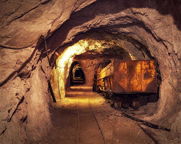 Mine Shaft Old, rusty mining machine deep underground in a lead and zinc mine (Mezica, Slovenia). copper mining stock pictures, royalty-free photos & images