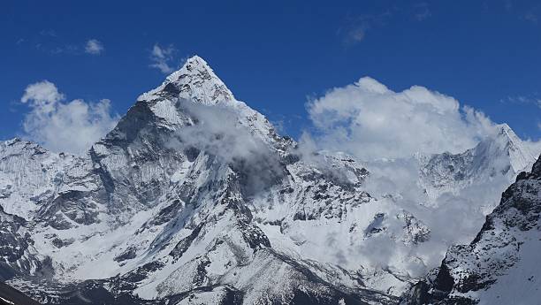 istock Peak of Ama Dablam surrounded by clouds 478344892