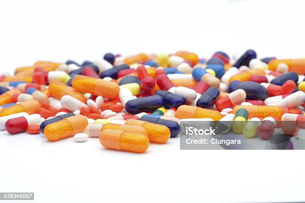 Pills Isolated On White Background Stock Photo - Download Image Now - Addiction, Antibiotic, Blue