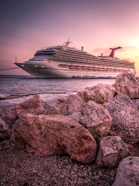 Willemstad, Curacao  - May 27, 2015: The Carnival Conquest is docked in the port of Curacao at sunset