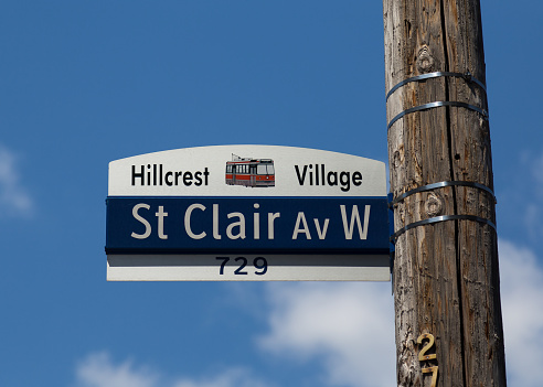 Toronto, Canada - June 2, 2015: A closeup to a sign for St Clair Avenue West in the Hillcrest Village area of Toronto