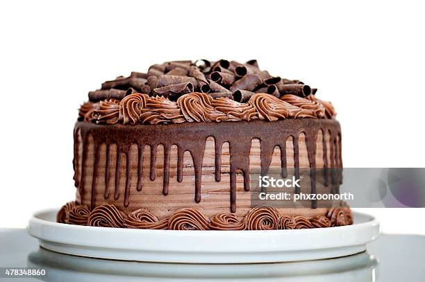 Chocolate Cake With Chocolate Fudge Drizzled Icing And Chocolate Curls Stock Photo - Download Image Now