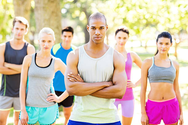istock Fit Man With Friends In Background At Park 478351710