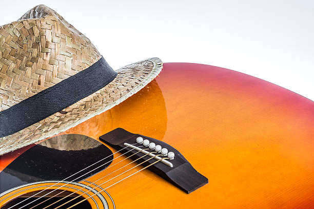 istock Acoustic Guitar Bridge and a Panama hat 478352332