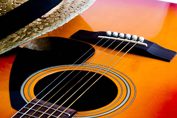 istock Acoustic Guitar Bridge and a Panama hat 478352334
