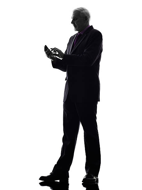 istock senior business man on the telephone text messaging silhouette 478352537