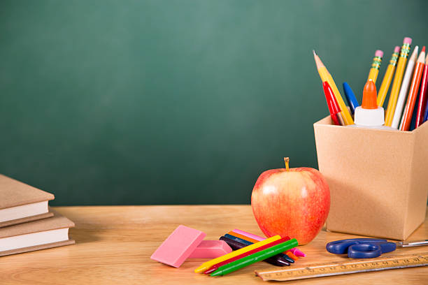istock Back to school. School supplies, apple on desk. Education. 478352912