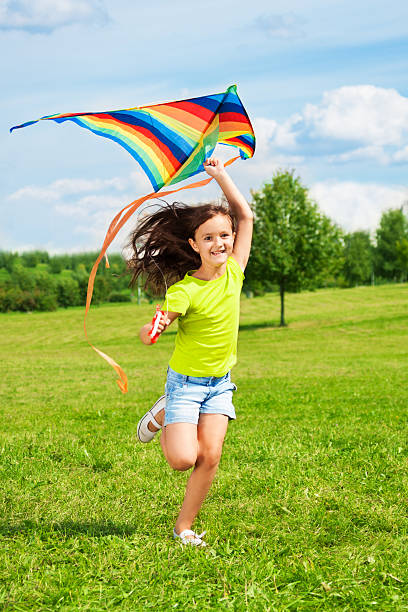istock Laughing girl with kite 478353099