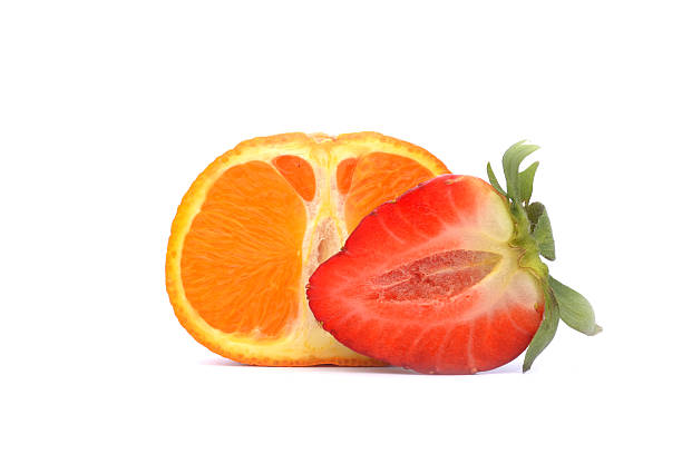 Strawberries and tangerine isolated on white background