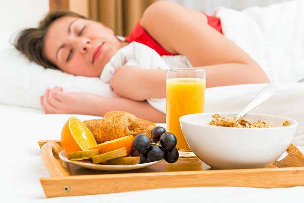 healthy breakfast in focus and sleeping girl
