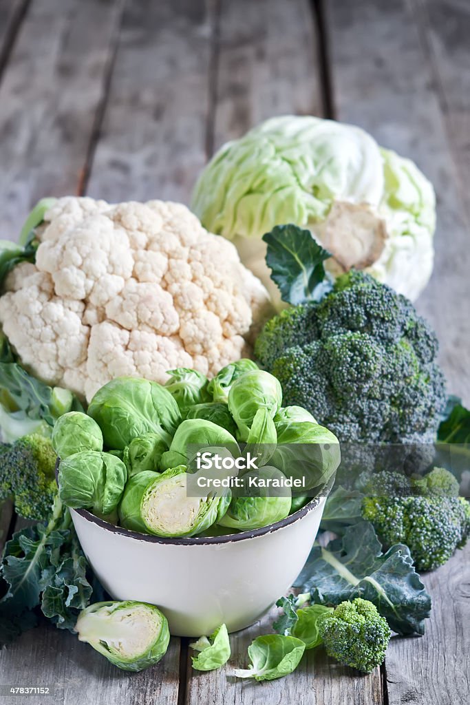Assortment of cabbages Assortment of cabbages on old wood background Broccoli Stock Photo