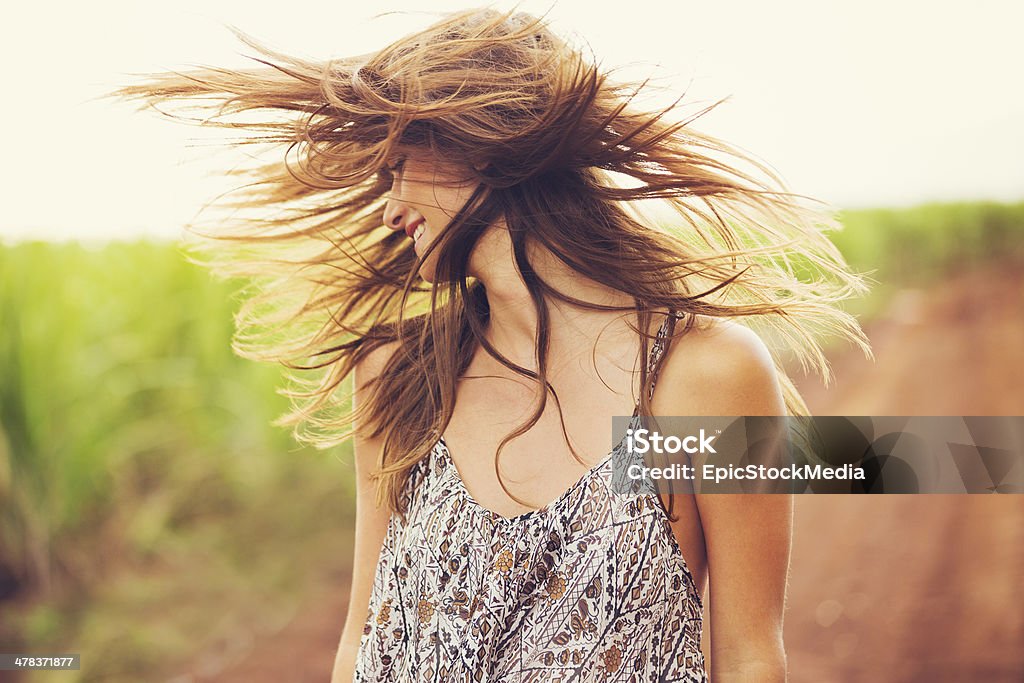 Gorgeous Romantic Girl Outdoors. Summer Lifestyle Gorgeous Romantic Girl Outdoors. Beautiful  Model in Short Dress in Field. Long Hair Blowing in the Wind. Backlit, Warm Color Tones Adult Stock Photo