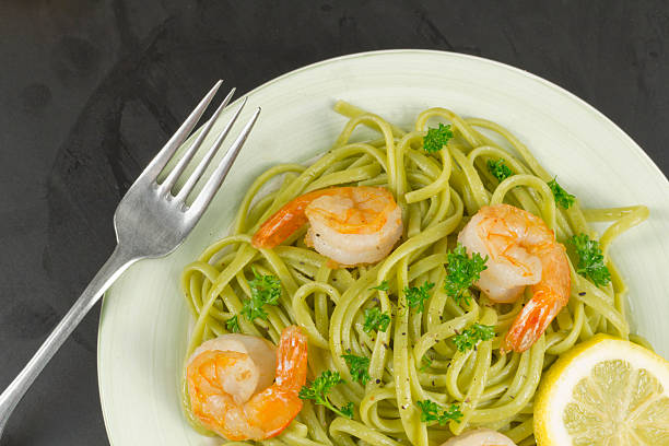 Shrimp Scampi Shrimp scampi with linguine lemon and parsley spinach pasta stock pictures, royalty-free photos & images