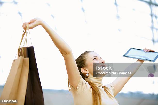 Beautiful Woman Making Online Shopping Using Digital Tablet Stock Photo - Download Image Now