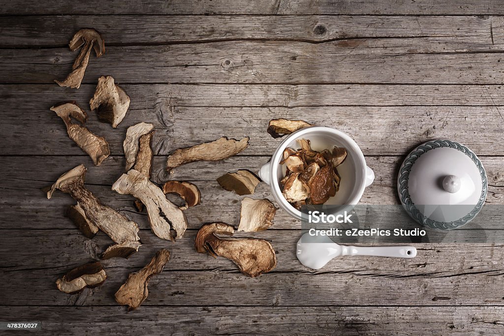 Dried Porcini Soaking Porcini mushrooms dried and soaking in the water, overhead shot. Asian Culture Stock Photo