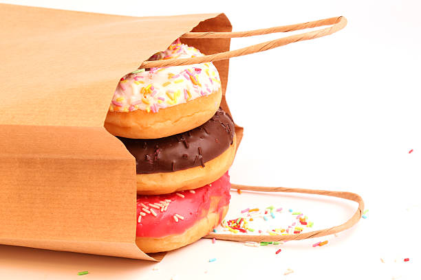 istock Fried donuts in a paper shopping bags 478377376
