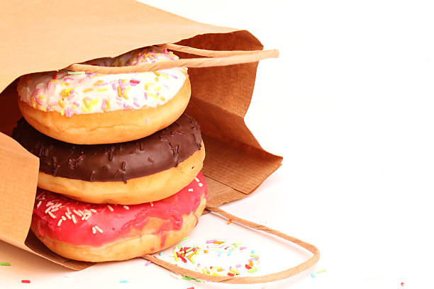 istock Fried donuts in a paper shopping bags 478377386