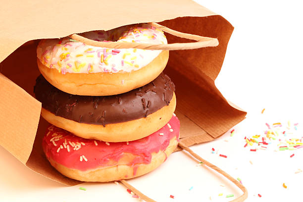 istock Fried donuts in a paper shopping bags 478377406