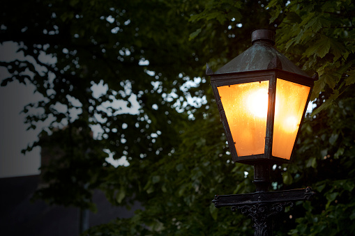 Old fashioned street lamp at dusk in Dublin City.