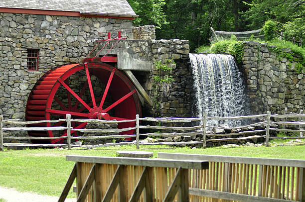 istock Gristmill and Waterfall with Wooden Bridge 478378988