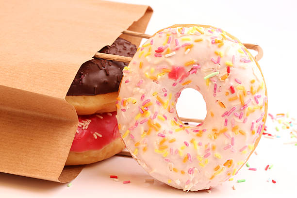 istock Fried donuts in a paper shopping bags 478379654