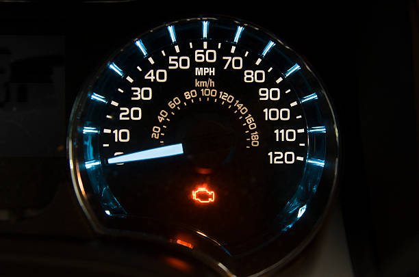 Check engine light Check engine light on on a  speed gauge of a modern vehicle kilometer photos stock pictures, royalty-free photos & images