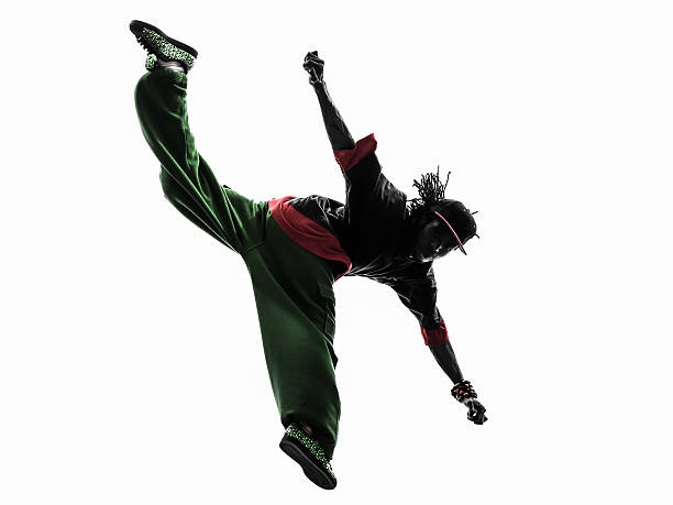 istock hip hop acrobatic break dancer breakdancing young man jumping silhouette 478381997