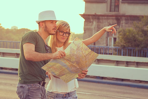 istock Tourists with city map 478386368